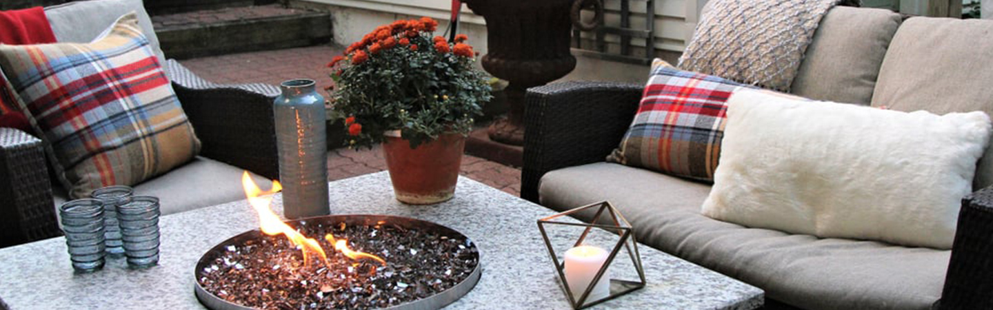 Outdoor couch and fireplace setting.
